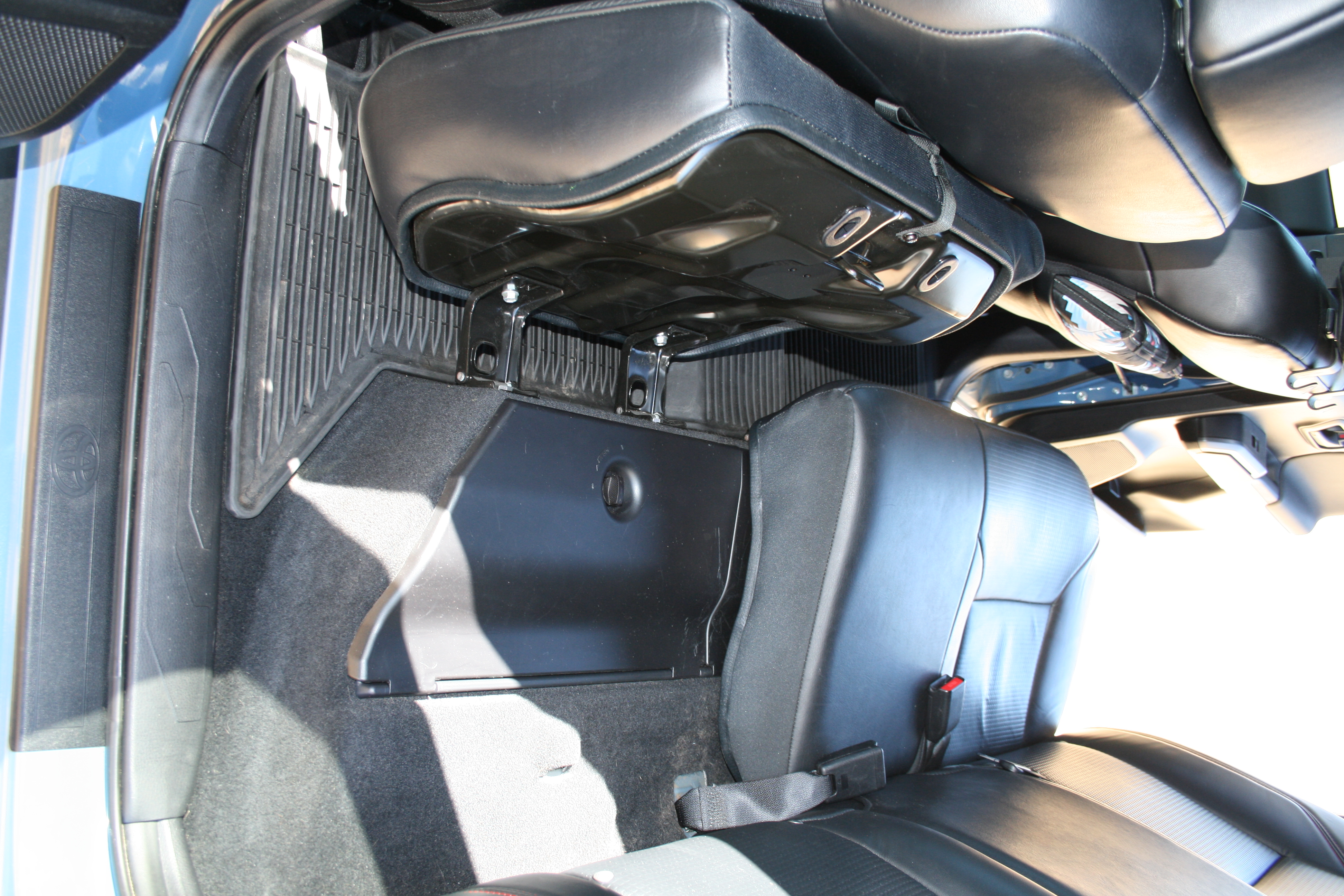 2018 Tacoma TRD Pro rear seat folded forward showing behind-seat storage compartment