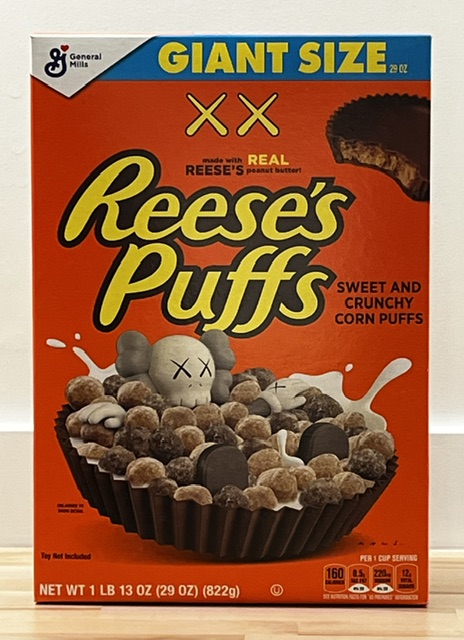 KAWS x Reese's Puffs limited edition Giant Size box — Companion submerged in the bowl