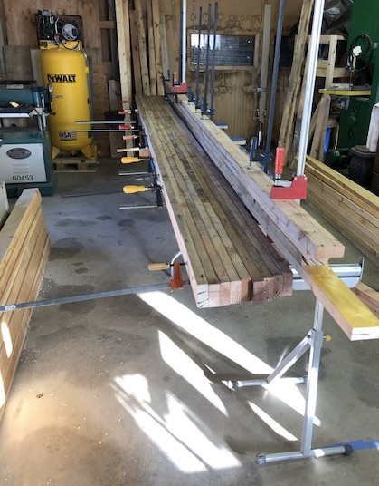 Early lamination — boards glued and clamped in first sections