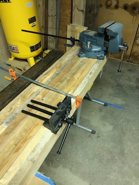 Slab surface detail — laminated timber, tight grain, knotwork across the width