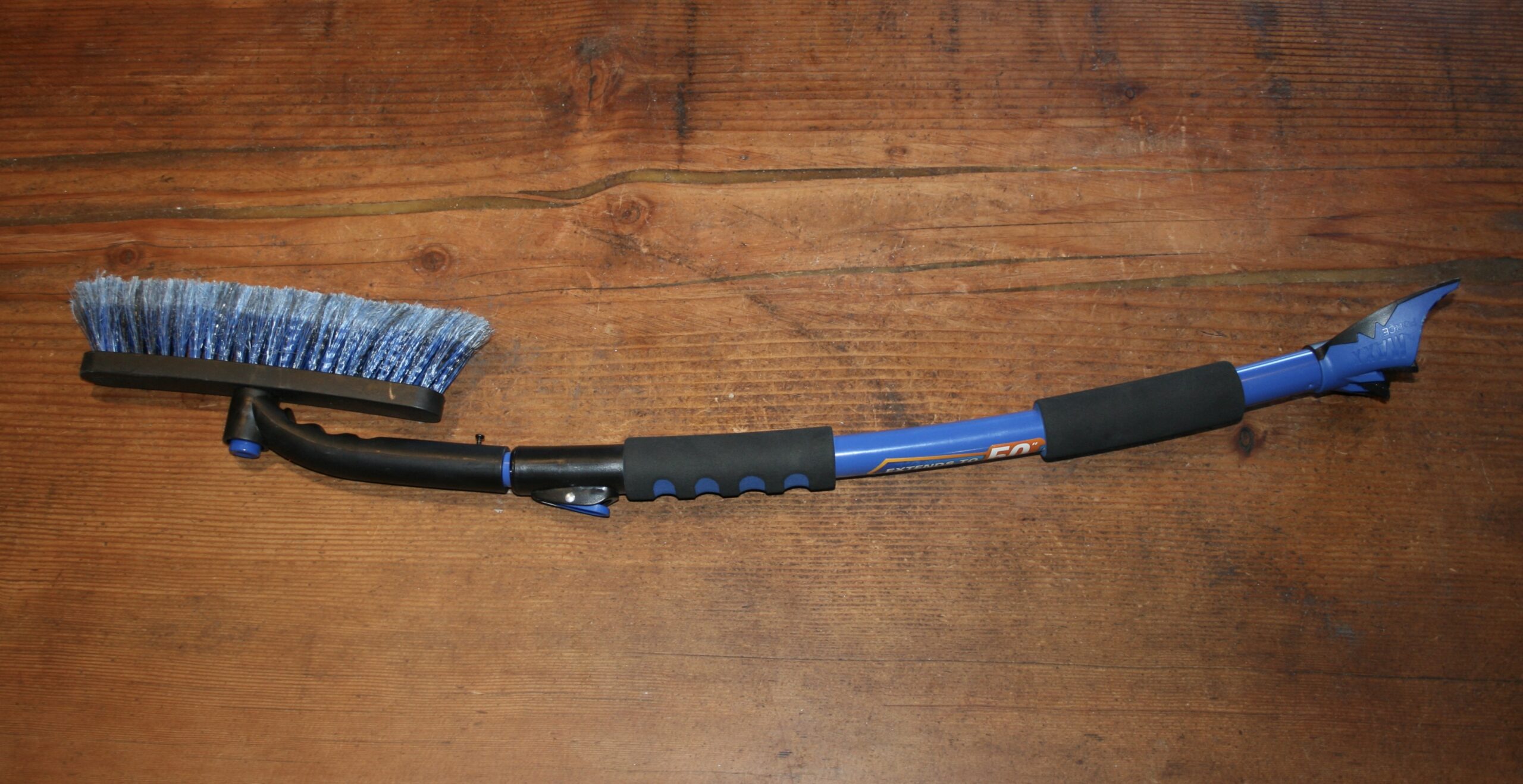 Extendable snow brush and ice scraper for truck